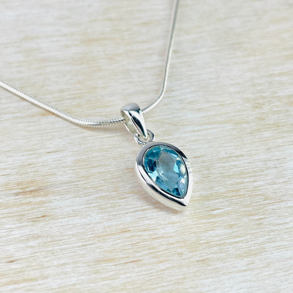 Inverted Tear Drop Blue Topaz and Sterling Silver Pendant.