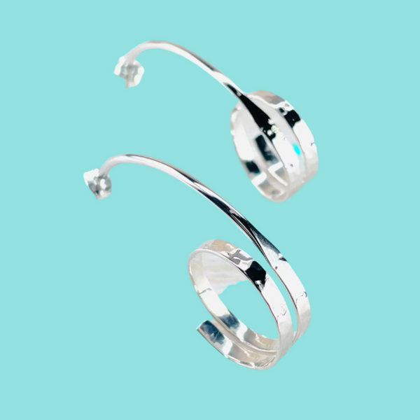 Sterling Silver Elongated Hoop Earrings.