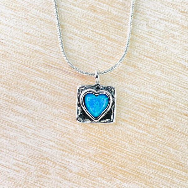 Delicate Silver and Opal Heart in a Square Pendant.