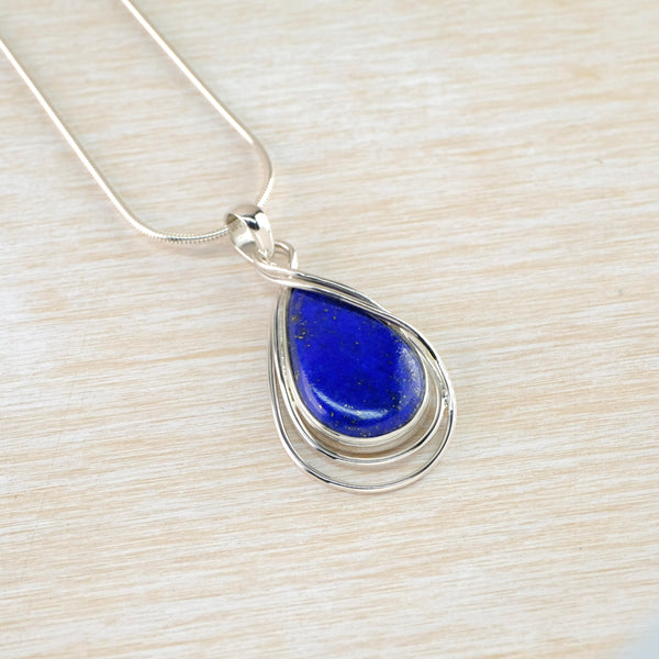 Tear Drop Lapis Lazuli Pendant With Double Silver Overlay.