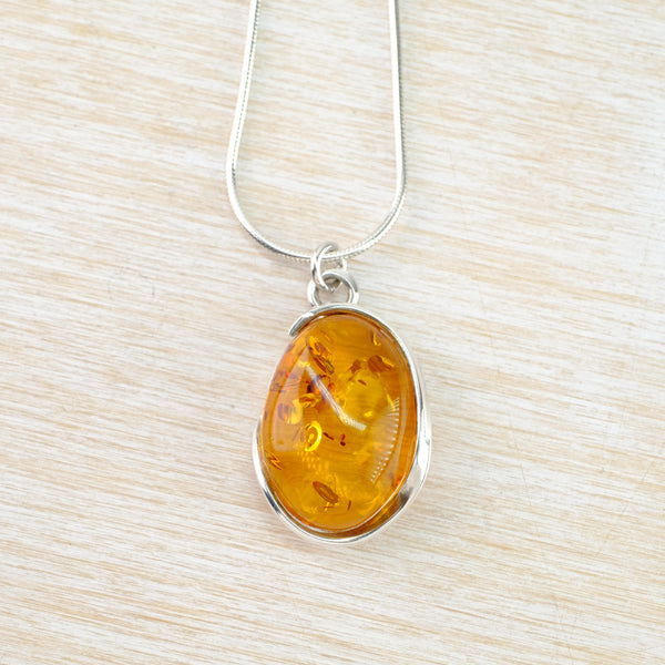 Oval Baltic Amber and Sterling Silver Pendant.