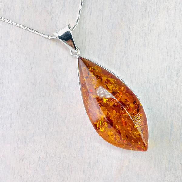 Large Diamond Shaped Amber and Silver Pendant.