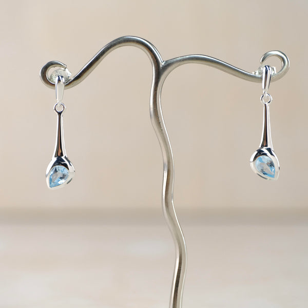 Pear Shaped Blue Topaz and Silver Drop Earrings by JB Designs.