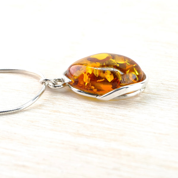 Oval Baltic Amber and Sterling Silver Pendant.