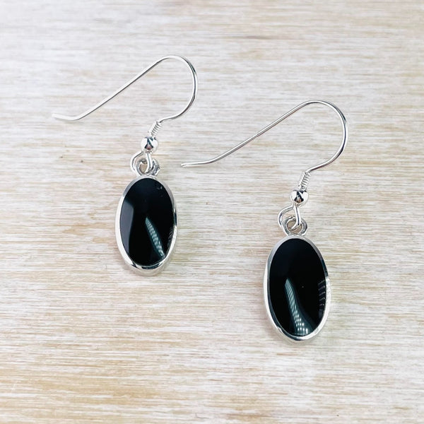 Sterling Silver and Oval Black Onyx Drop Earrings.