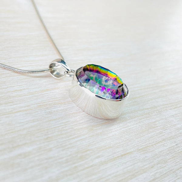 Oval Sterling Silver and Mystic Topaz Pendant.