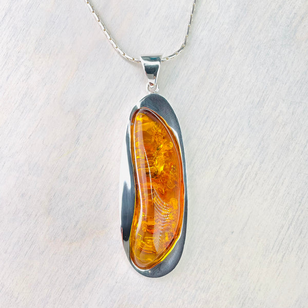 Long Elegant Amber and Silver Pendant.