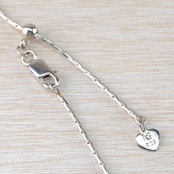 Sterling Silver, Fine Enamel And White Sapphire Infinity Pendant by Nicole Barr.