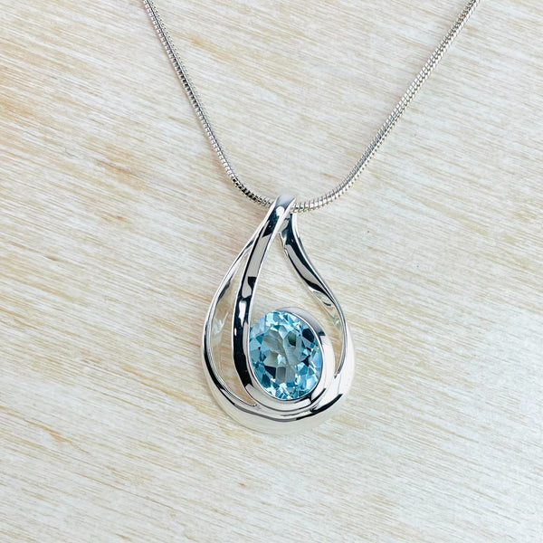 Contemporary Organic Blue Topaz and Silver Pendant.