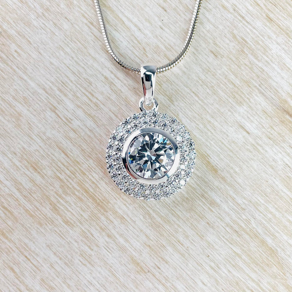 Circular Sterling Silver and Pavé set CZ Pendant.