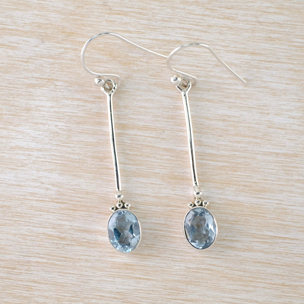 Long Silver and Faceted Blue Topaz Drop Earrings.