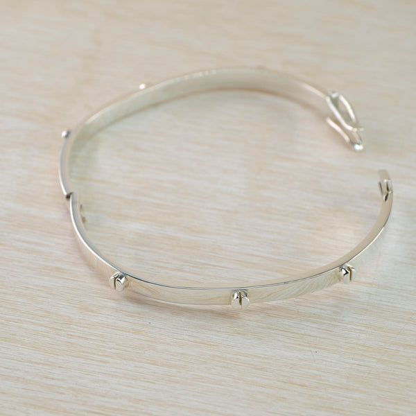 Polished Silver Locking Bangle with Screwhead Details.