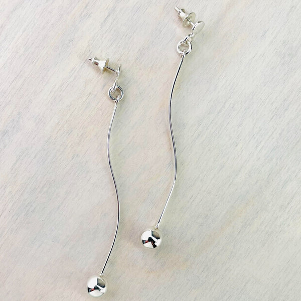 Long Silver Wavy Stick and Ball Drop Earrings.