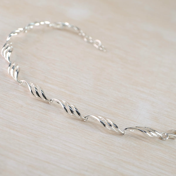 Polished Open Waved Silver Linked Bracelet by JB Designs.