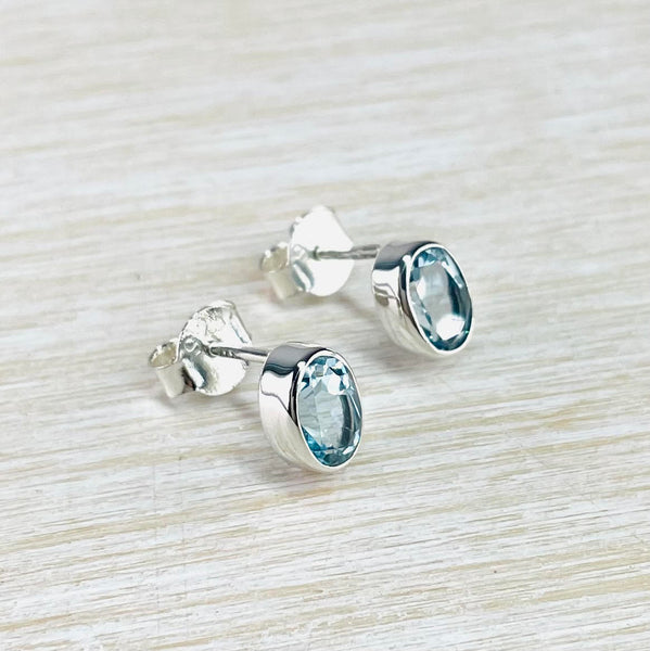 Oval Blue Topaz and Sterling Silver Stud Earrings.