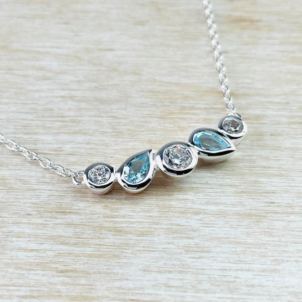 Contemporary Cubic Zirconia, Blue Topaz and Sterling Silver Necklace by JB Designs.