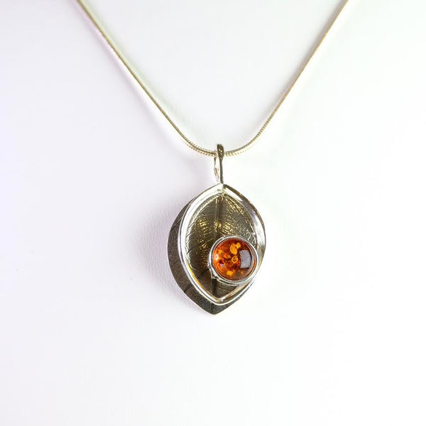 Two Piece Amber and Silver Pendant.