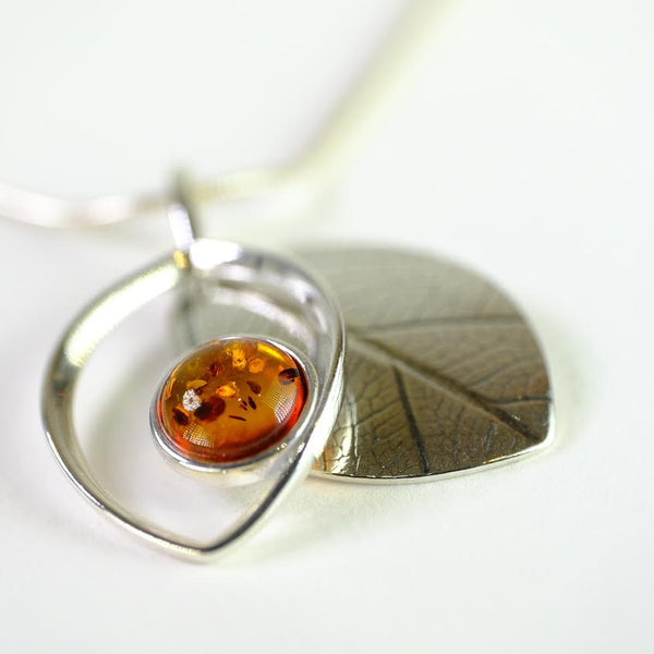 Two Piece Amber and Silver Pendant.