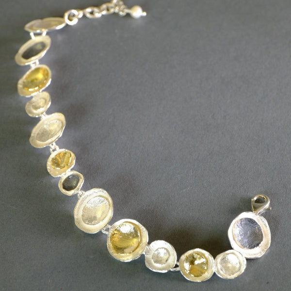 Circular Satin Silver and Gold Plated Linked Bracelet by JB Designs.