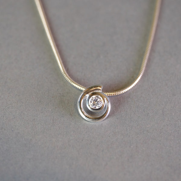 Sterling Silver and CZ Swirl Pendant by JB Designs.