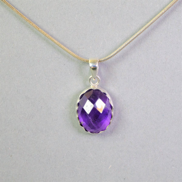 Oval Faceted Amethyst and Sterling Silver Pendant.