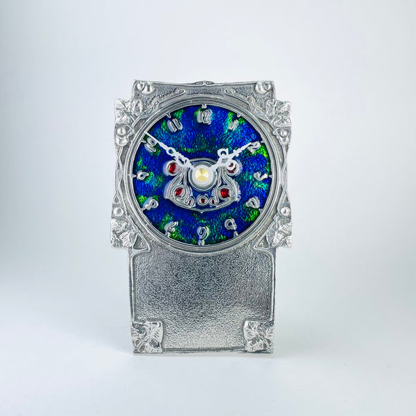 Pewter and Enamel Mantel clock, Archibald Knox Design.