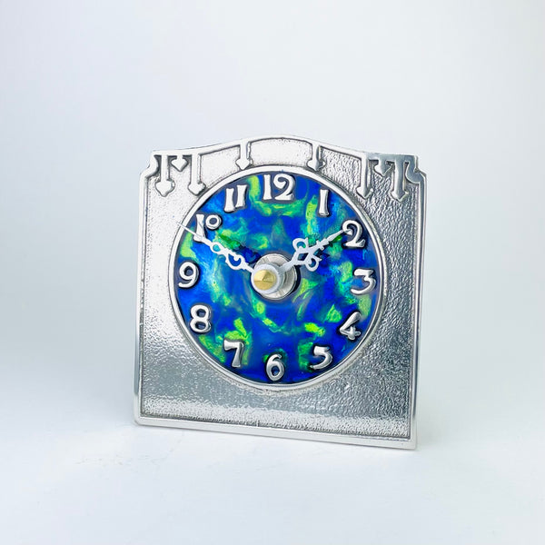 Pewter and Enamel Mantel clock, Archibald Knox design.