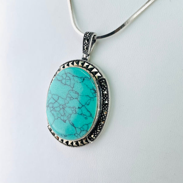 Oval Silver, Turquoise and Marcasite Pendant.