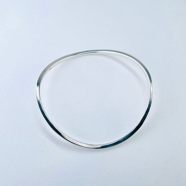 Polished Silver Curved Sterling Silver Bangle.