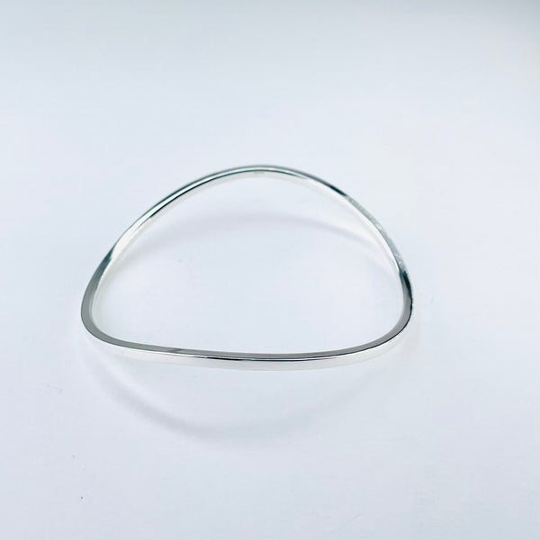 Polished Silver Curved Sterling Silver Bangle.