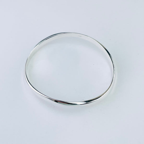 Gently Waved Sterling Silver Bangle.