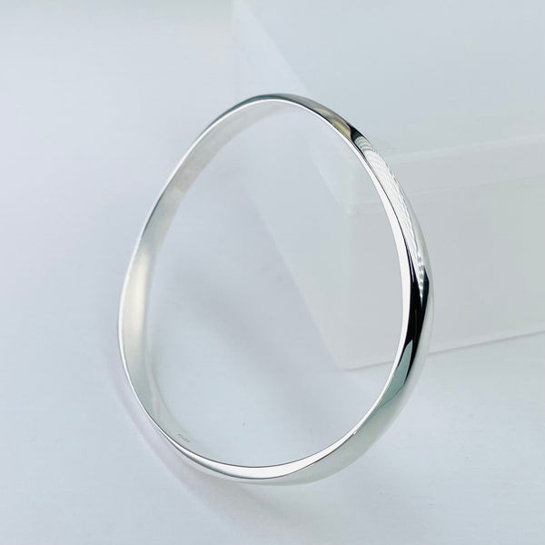 Gently Waved Sterling Silver Bangle.