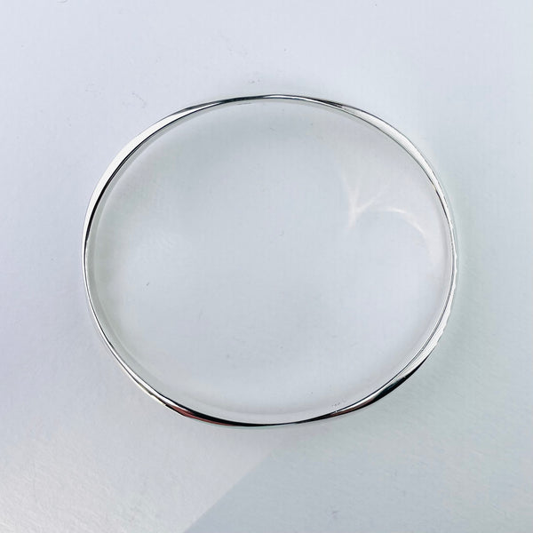 Gently Waved Sterling Silver Bangle.