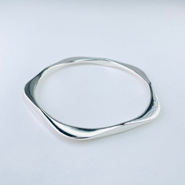 Five Curves Sterling Silver Bangle.