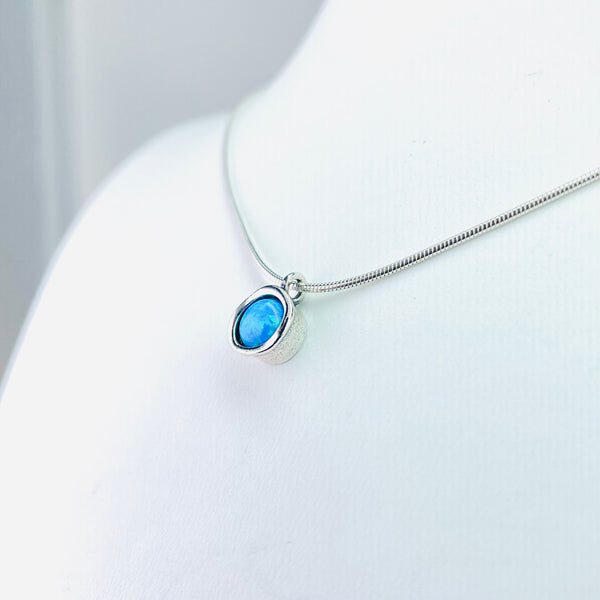 Simple Round Silver and Opal Pendant.