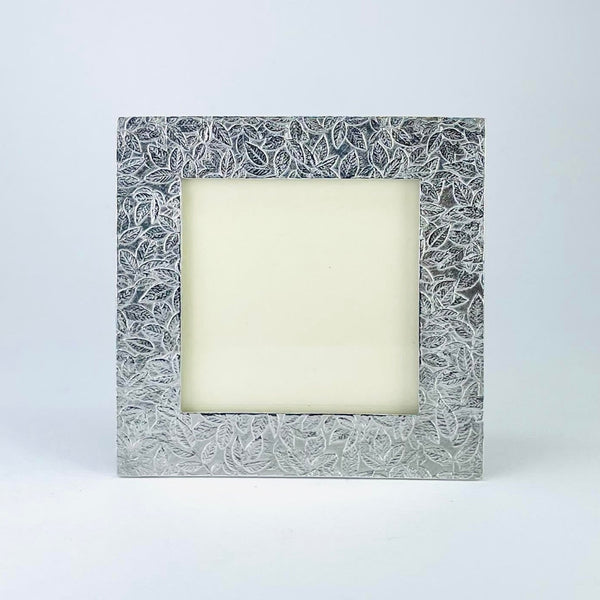Square pewter frame with a leaf design. The leaves are small and scattered across the whole frame covering all the space in a random fashion.,