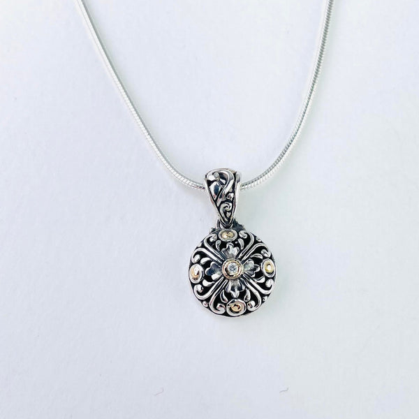 Silver, Cubic Zirconia and Gold Pendant.