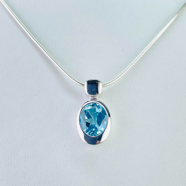 Oval Blue Topaz and Silver Pendant by JB Designs.