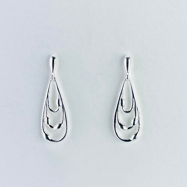 Tear drop shaped earrings. One larger tear drop, with a small smooth bean shape protusion attached towards the bottom.Within this are two smaller tear drop shapes with the same protusions. All attaced to a short stem on a post and butterfly fitting.