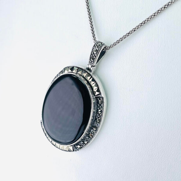 Silver, Marcasite and Black Onyx Oval Pendant.