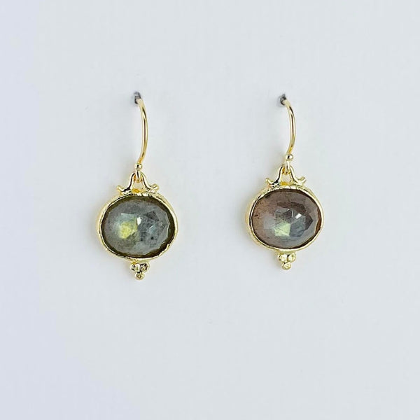 gold plated earrings. slightly off round faceted greeny/blue labradorite stones are set in textured gold coloured surrounds. At the bottom of each earring are three tiny ball shapes forming a triangular shape. The earrings are attached to the hooks by little handles....