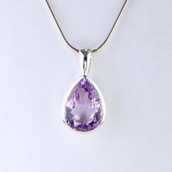 Sterling Silver and Faceted Amethyst Pendant.