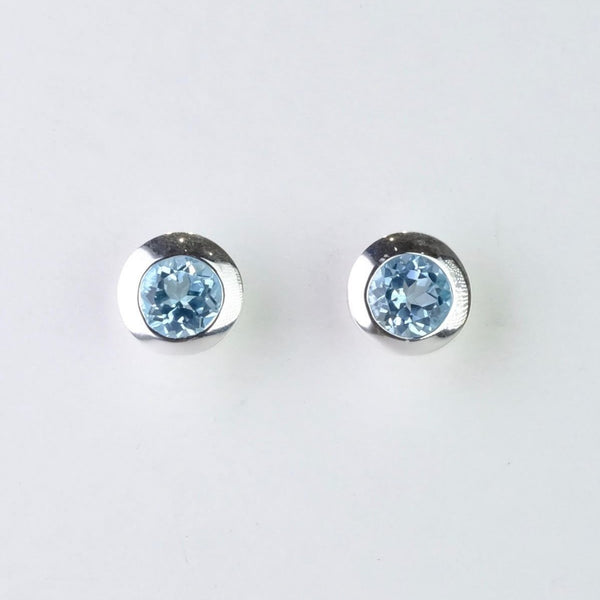 Round Silver and Blue Topaz Stud Earrings.