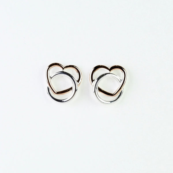 Silver and Rose Gold Heart Stud Earrings by 'Unique'