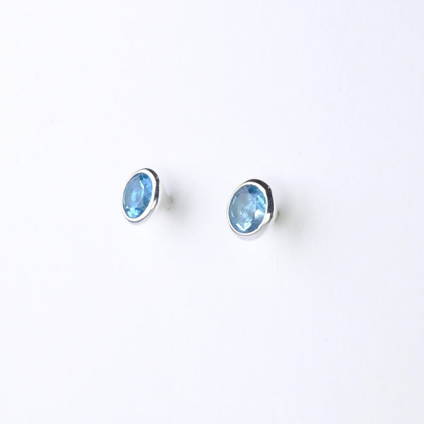 Conical Silver and Blue Topaz Stud Earrings.