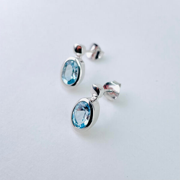 Oval Blue Topaz and Silver Stud Earrings by JB Designs.