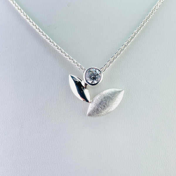 Satin Silver and Cubic Zirconia Pendant.
