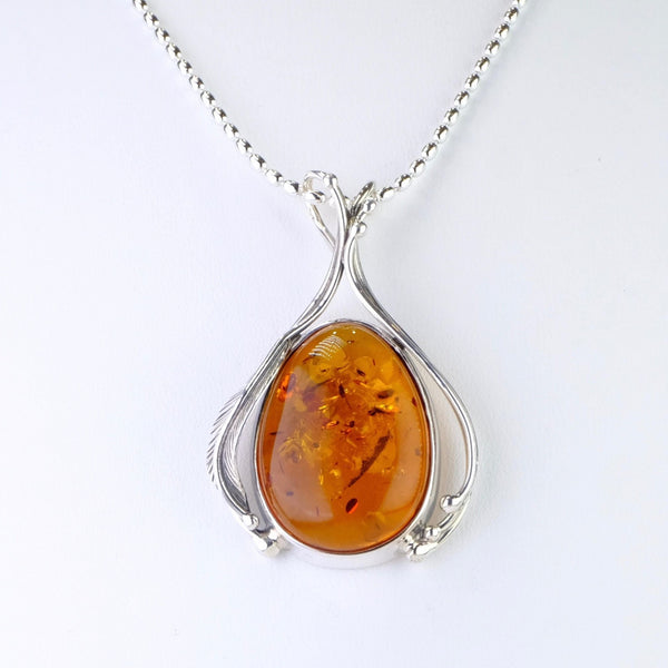 Decorated Amber and Silver Pendant.