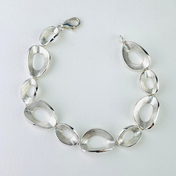 Satin, Textured Silver Linked Bracelet by JB Designs.