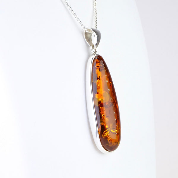 Long Elegant Amber and Silver Pendant.